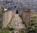 South Decumanus * The South Decumanus, a major cross street to the Cardo.  In the background is the modern city of Jerash. * 576 x 527 * (155KB)